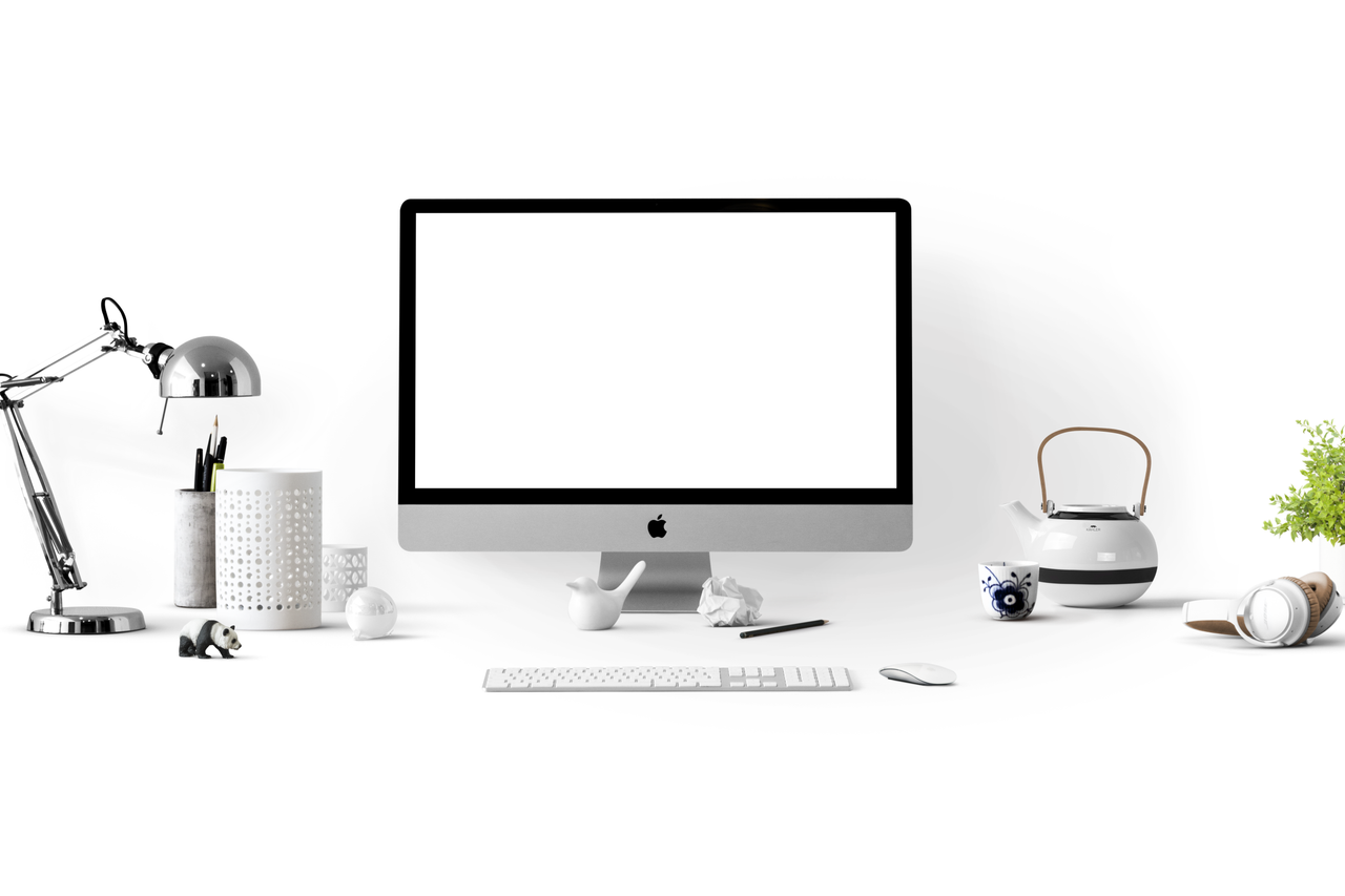 A clean office desk featuring an iMac, lamp, and stationery, ideal for technology-themed backgrounds.